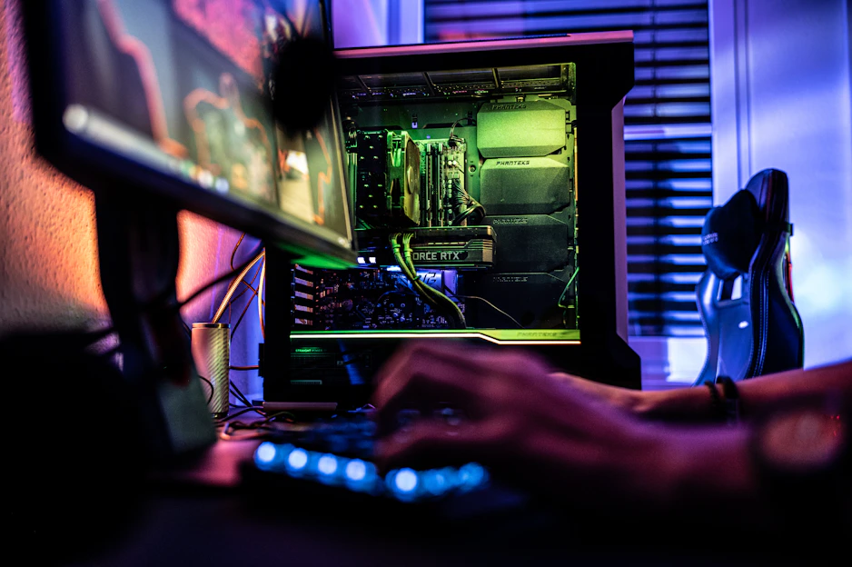 a person working on a computer in a dark room