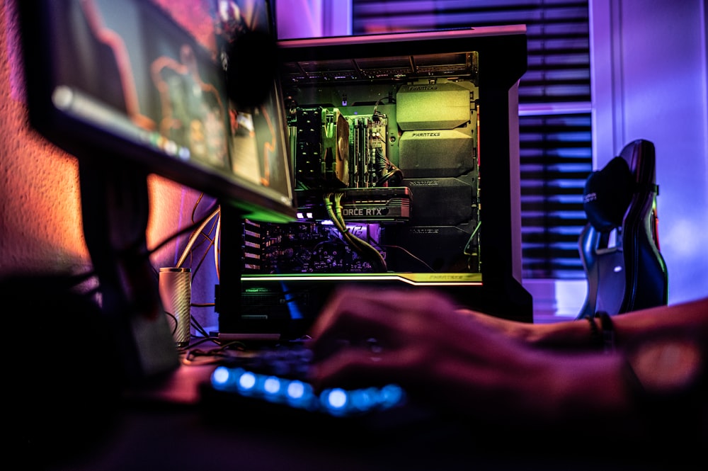 a person working on a computer in a dark room