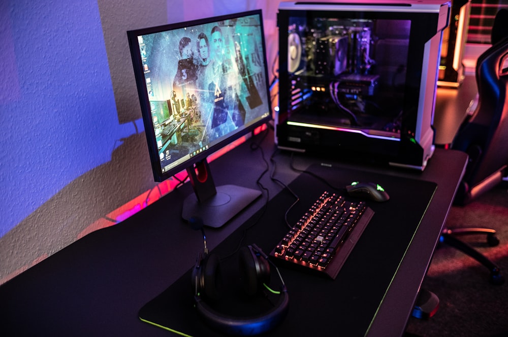 a computer desk with a keyboard and a monitor