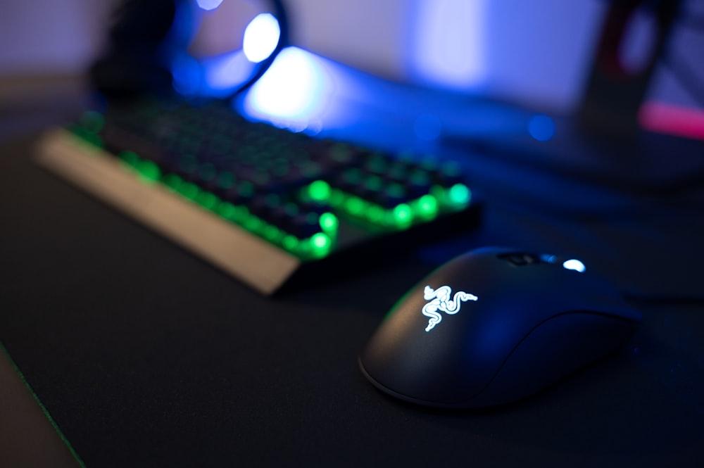 a close up of a keyboard and mouse on a desk