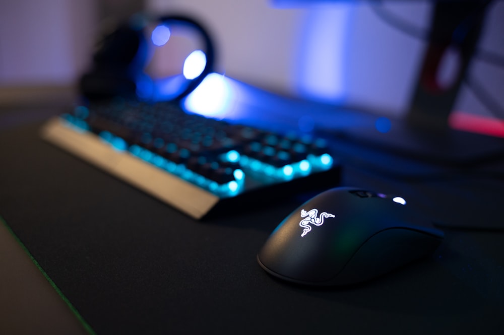 a computer mouse sitting next to a keyboard