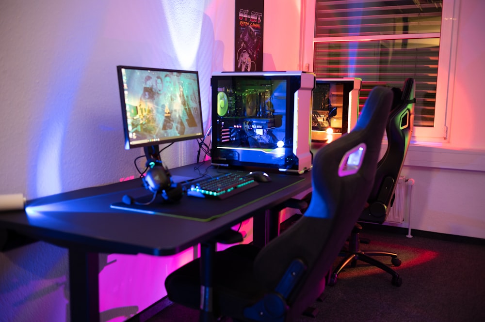 a computer desk with two monitors and a keyboard