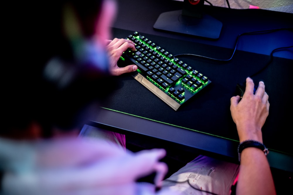 a person is typing on a computer keyboard