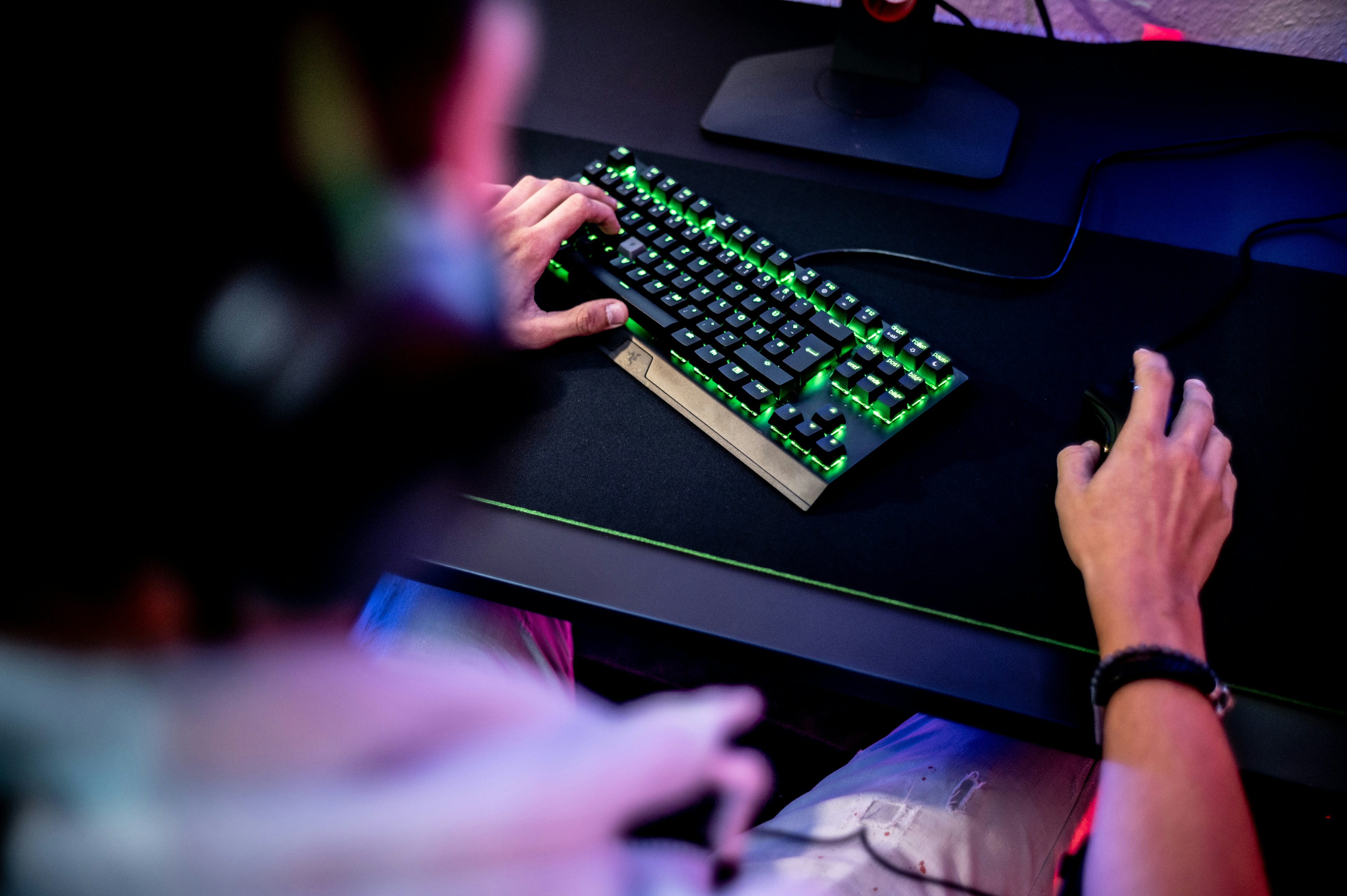 a person is typing on a computer keyboard