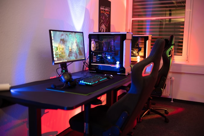 Gaming desk setup with keyboard and chair