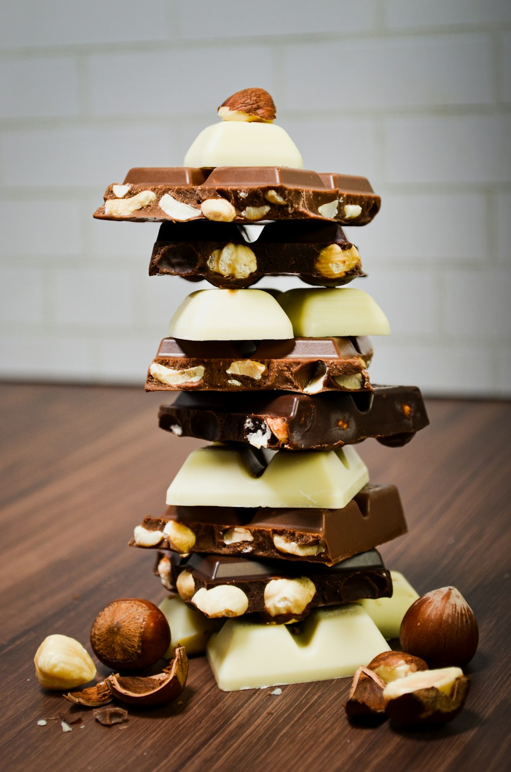 a stack of chocolate and nuts on a table