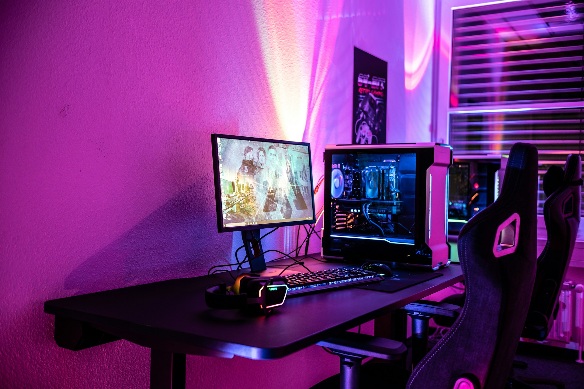 a desk with a laptop and a computer monitor