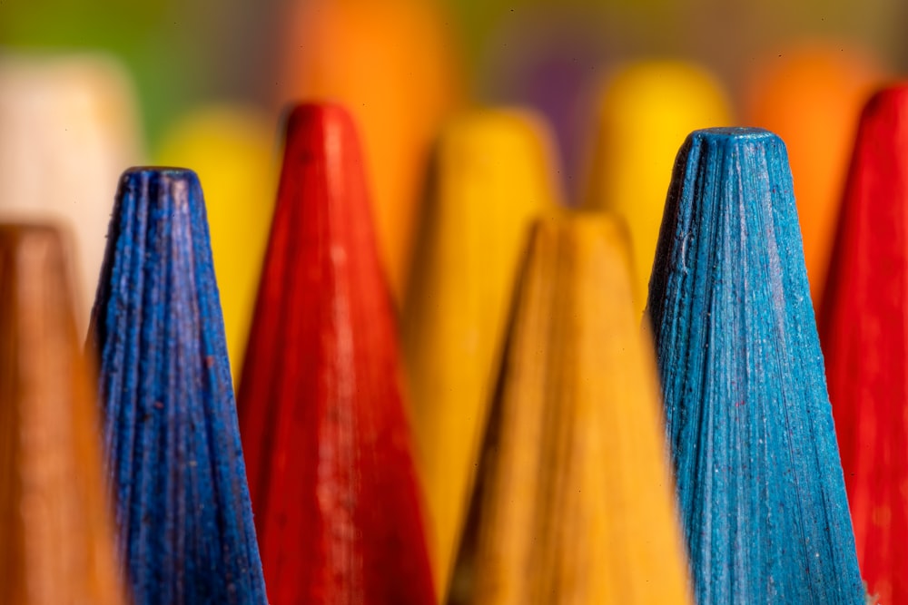 a close up of a row of colored pencils