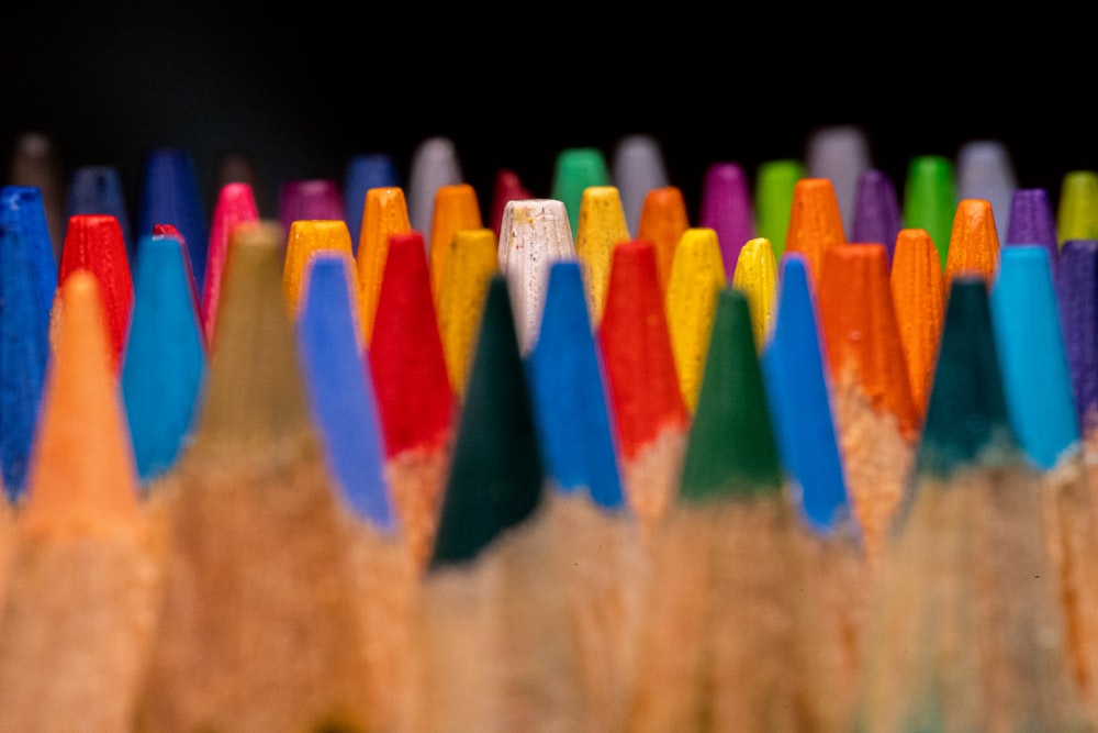 a close up of a group of colored pencils