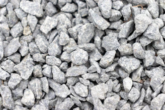 Close-up of crushed Brita 0 stones ready for construction use.
