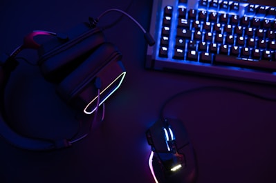 a computer mouse sitting next to a keyboard