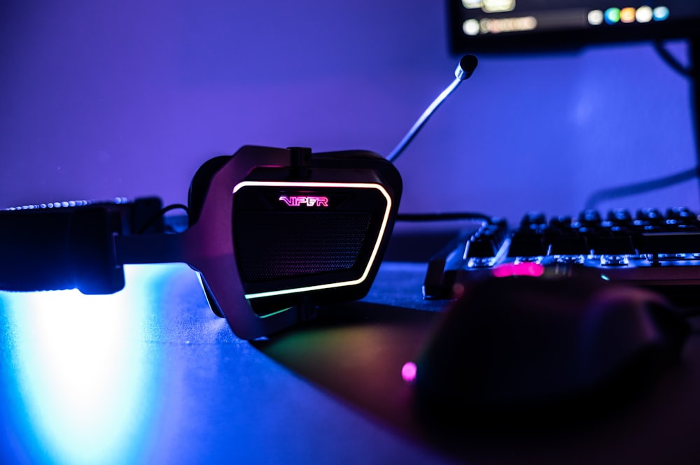 a computer mouse sitting on top of a desk next to a keyboard