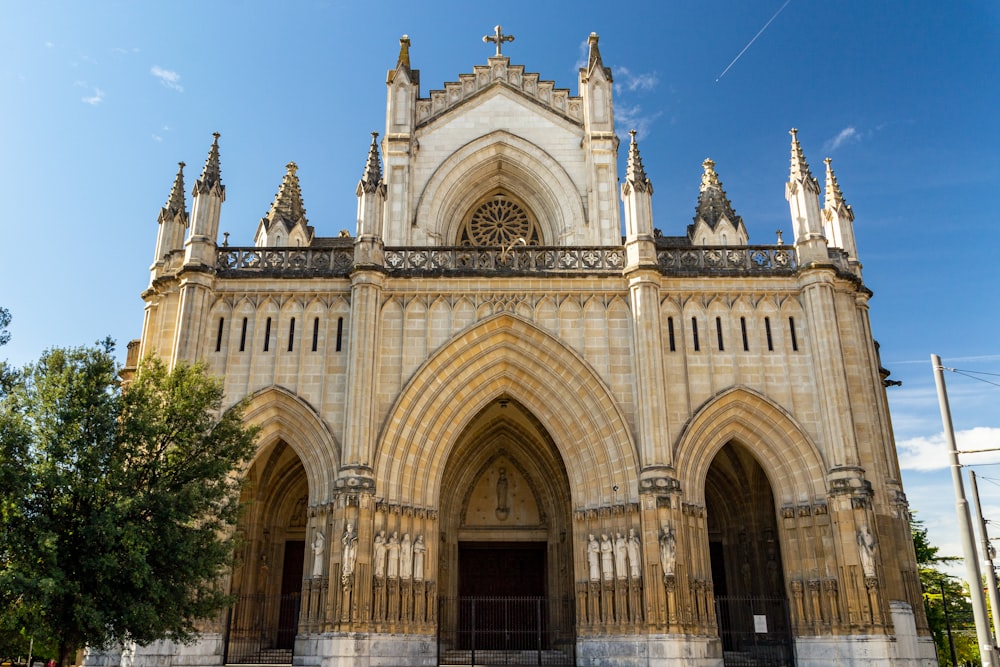 a large cathedral with a cross on the top of it