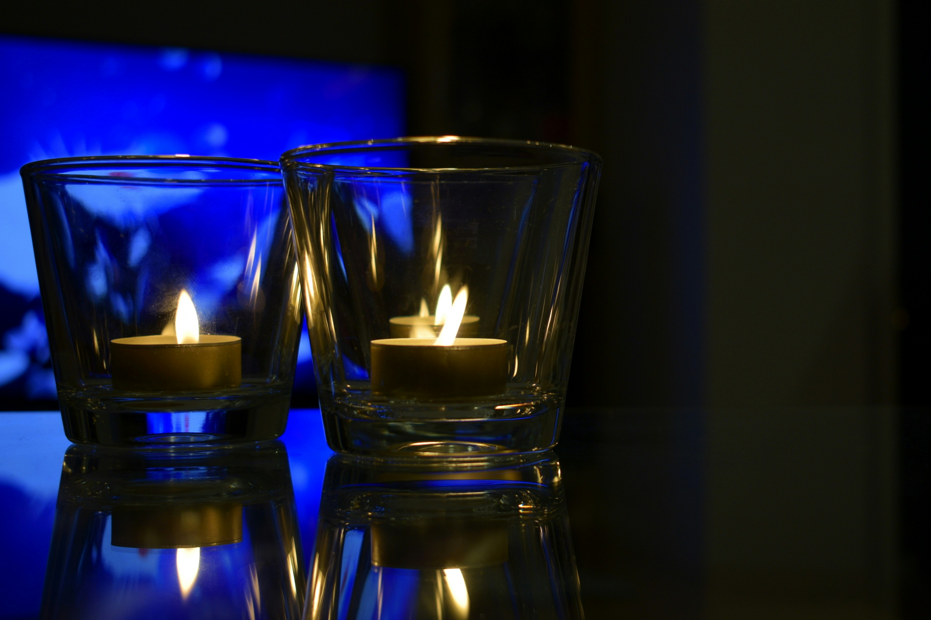 a couple of candles sitting on top of a table