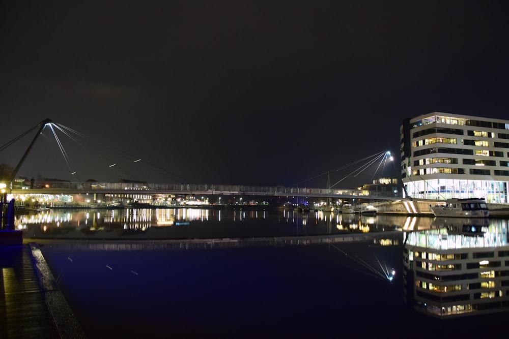 a bridge over a body of water at night