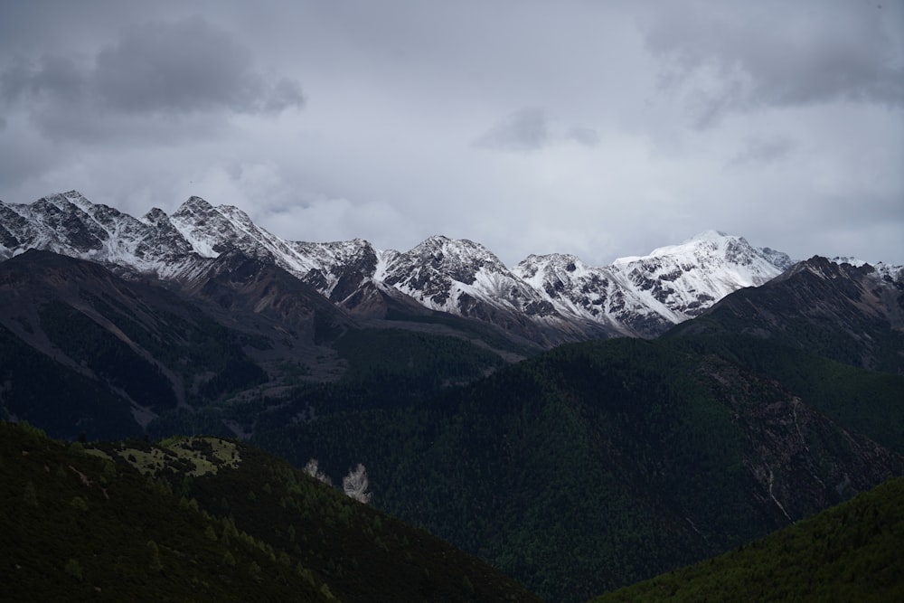 a view of a mountain range with snow on the top