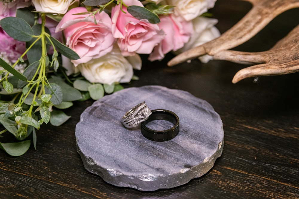 a couple of rings sitting on top of a wooden table