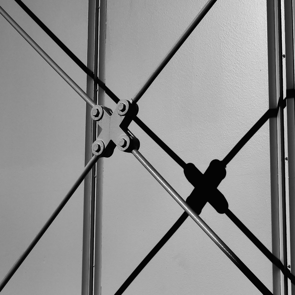 a black and white photo of a metal structure