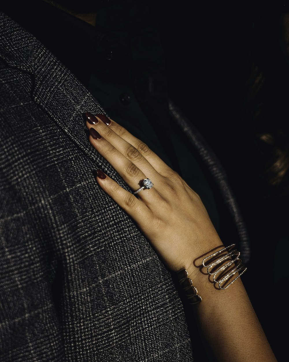 a close up of a person's hand with a ring on it