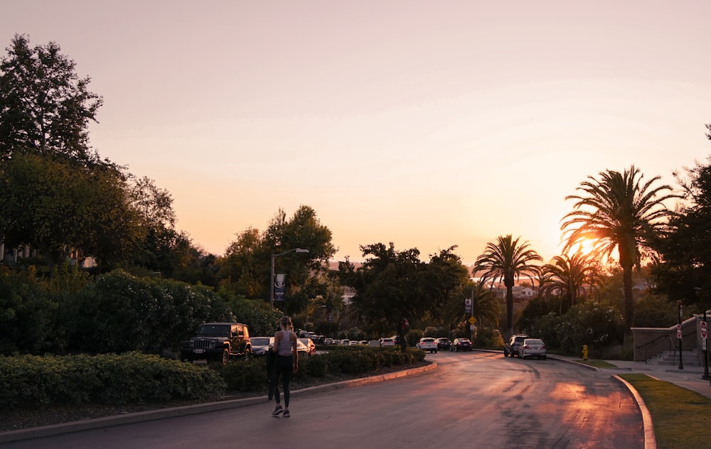 a man riding a skateboard down a street