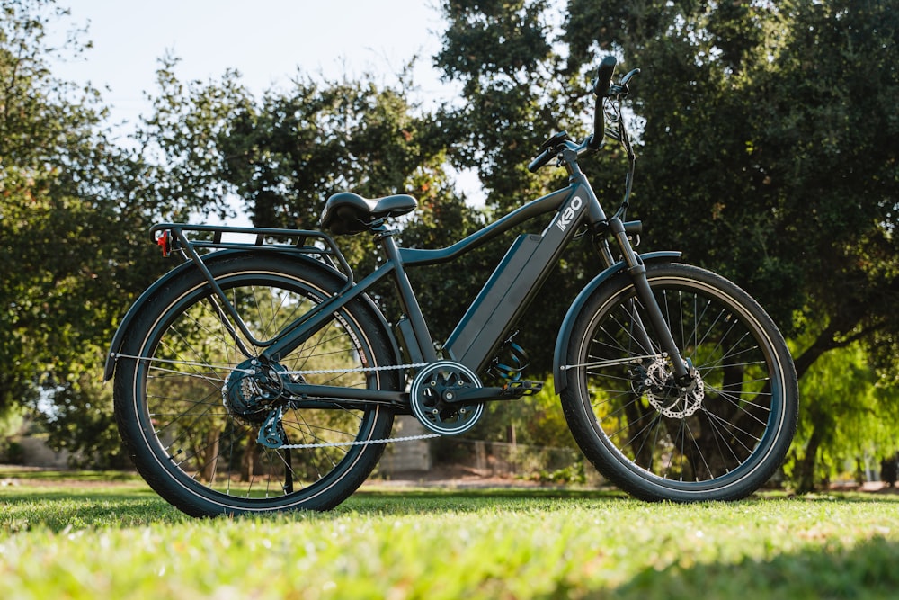 an electric bike parked in a park on a sunny day