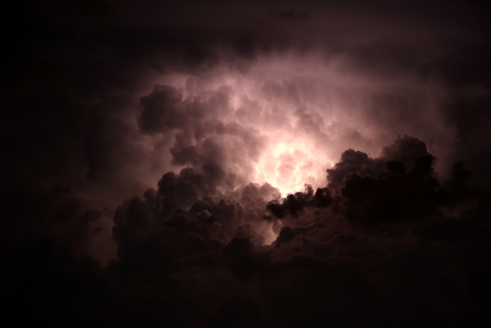 a large cloud with a lightning bolt coming out of it