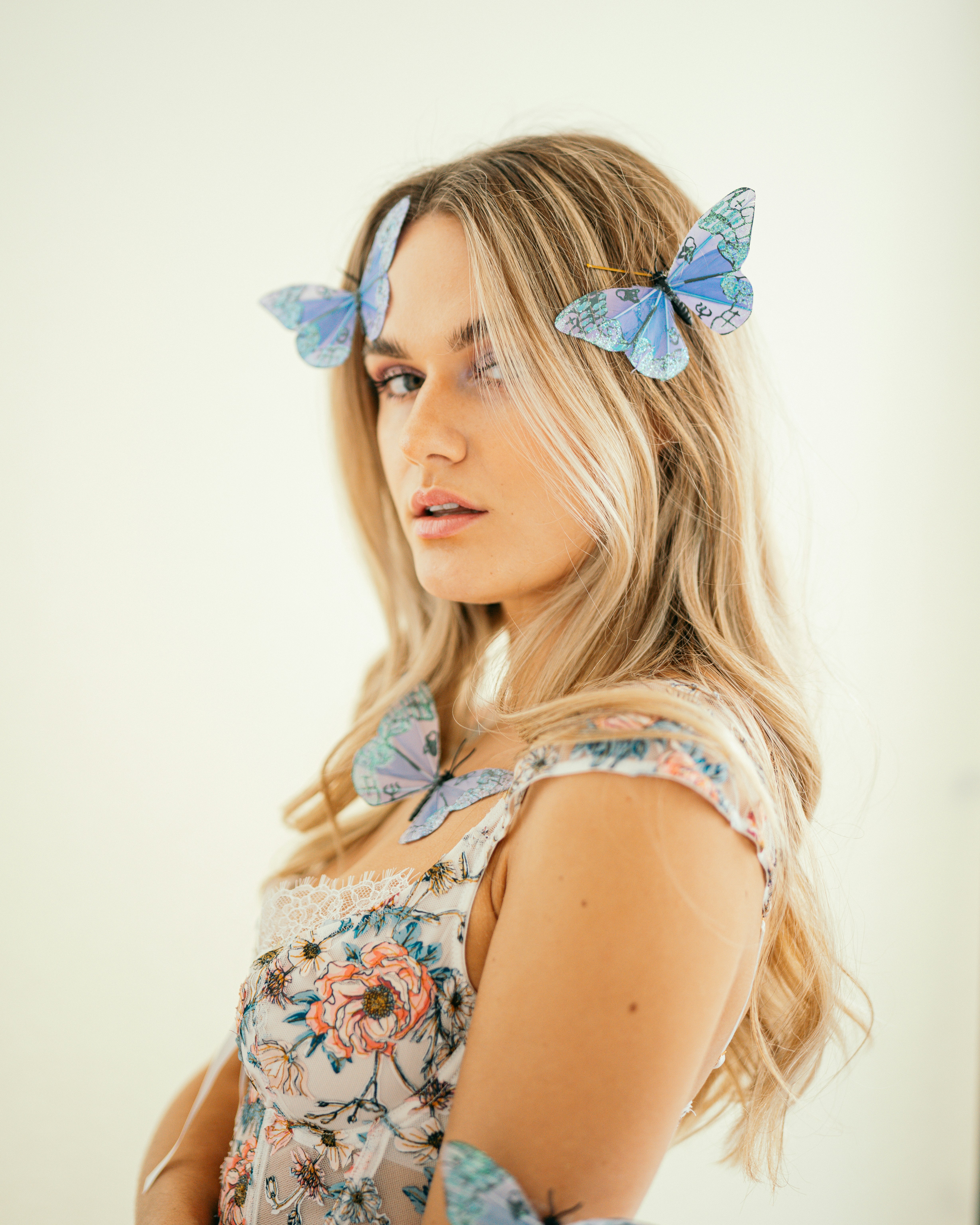 A woman with a blue butterfly on her head photo Free Minneapolis