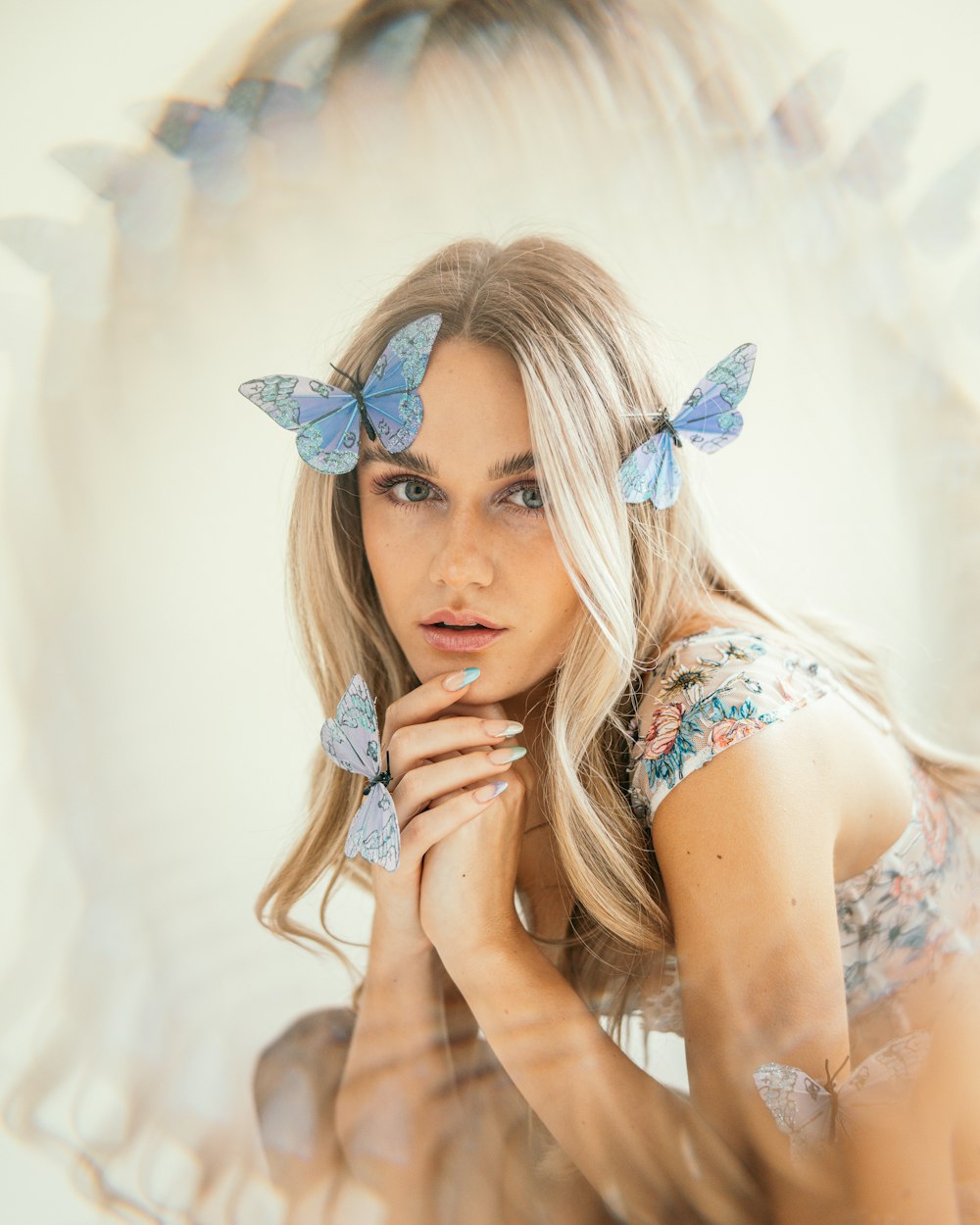 a woman with blue butterflies on her hair