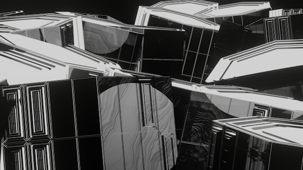 An abstract digital art piece featuring numerous geometric shapes and lines. The composition is dominated by white and black colors, with accents of gray, creating a high-contrast and modern look. The shapes appear to intertwine and overlap, giving a sense of depth and complexity.