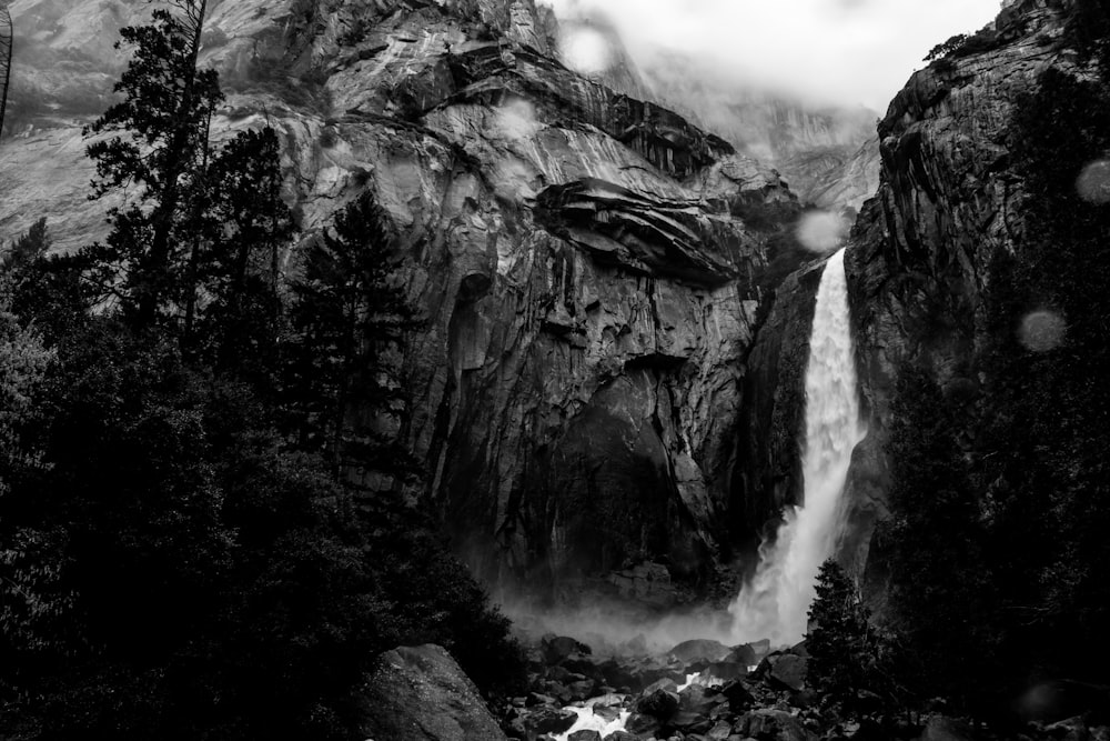 a black and white photo of a waterfall