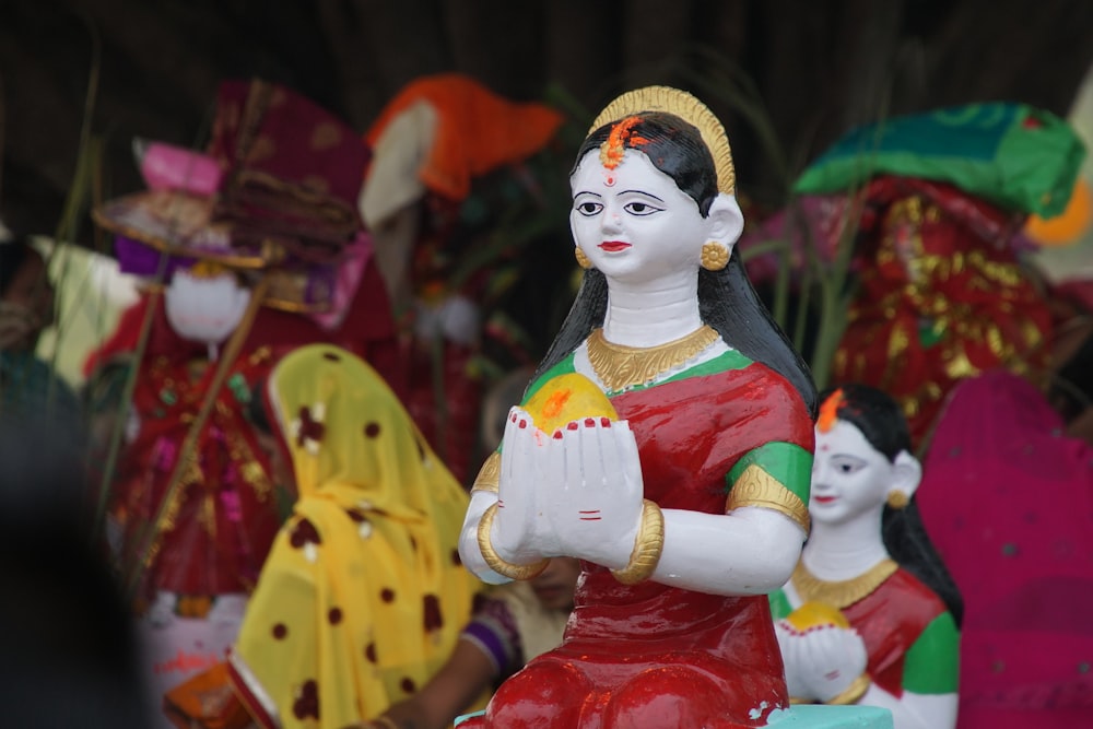 a statue of a woman sitting on top of a table