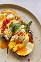 A beautifully plated breakfast dish featuring eggs and toast.