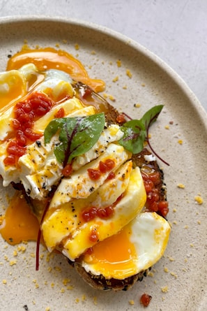 A beautifully plated breakfast dish featuring eggs and toast.