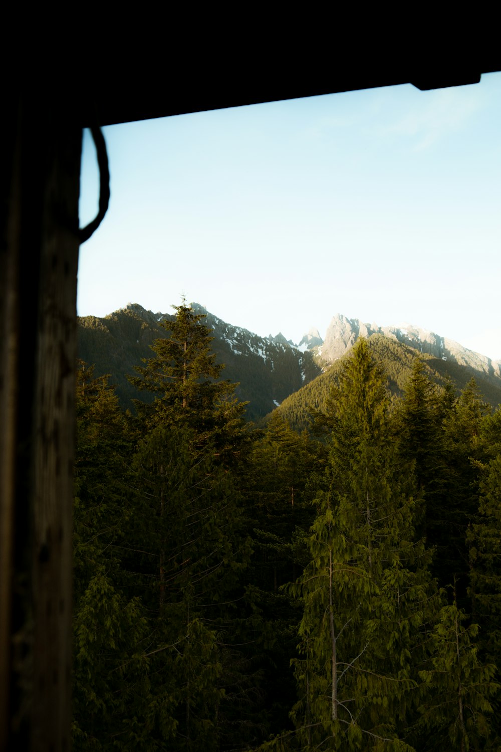 a view of a mountain range from a window