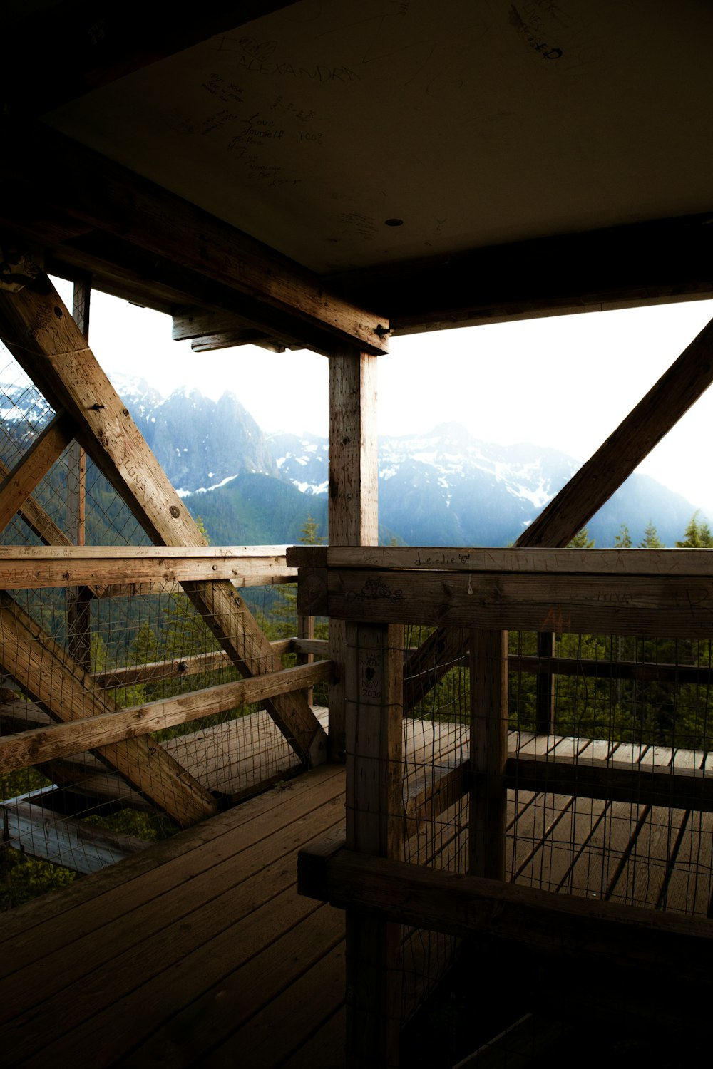 a wooden deck with a view of mountains