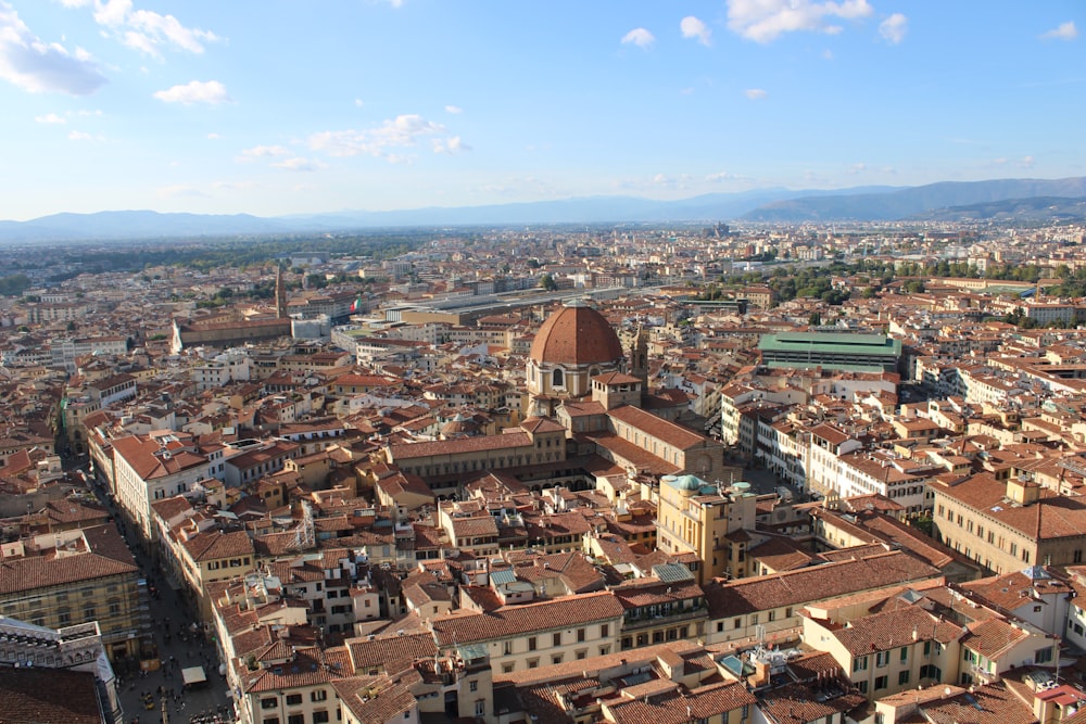 an aerial view of a city with tall buildings