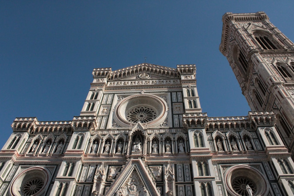 a very tall cathedral with a clock on it's side