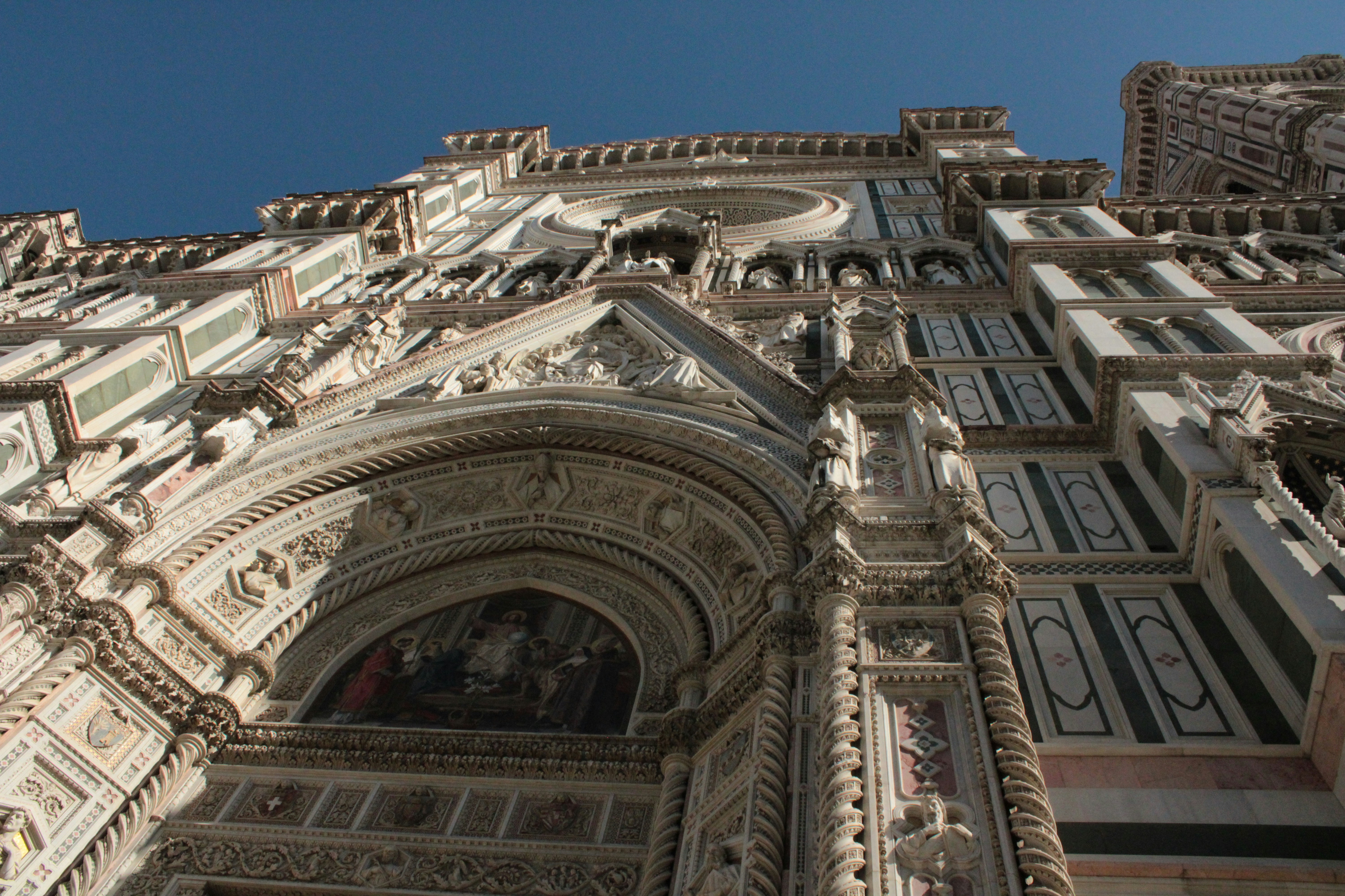 a very tall building with a clock on it's side