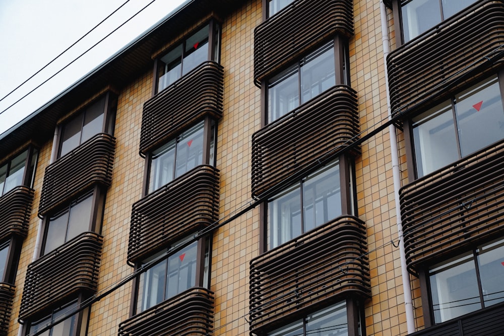 a tall building with lots of windows and balconies