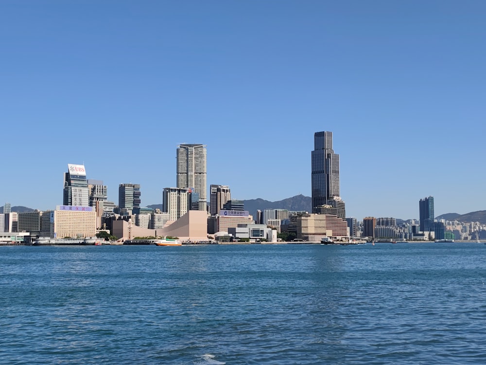 a large body of water with a city in the background