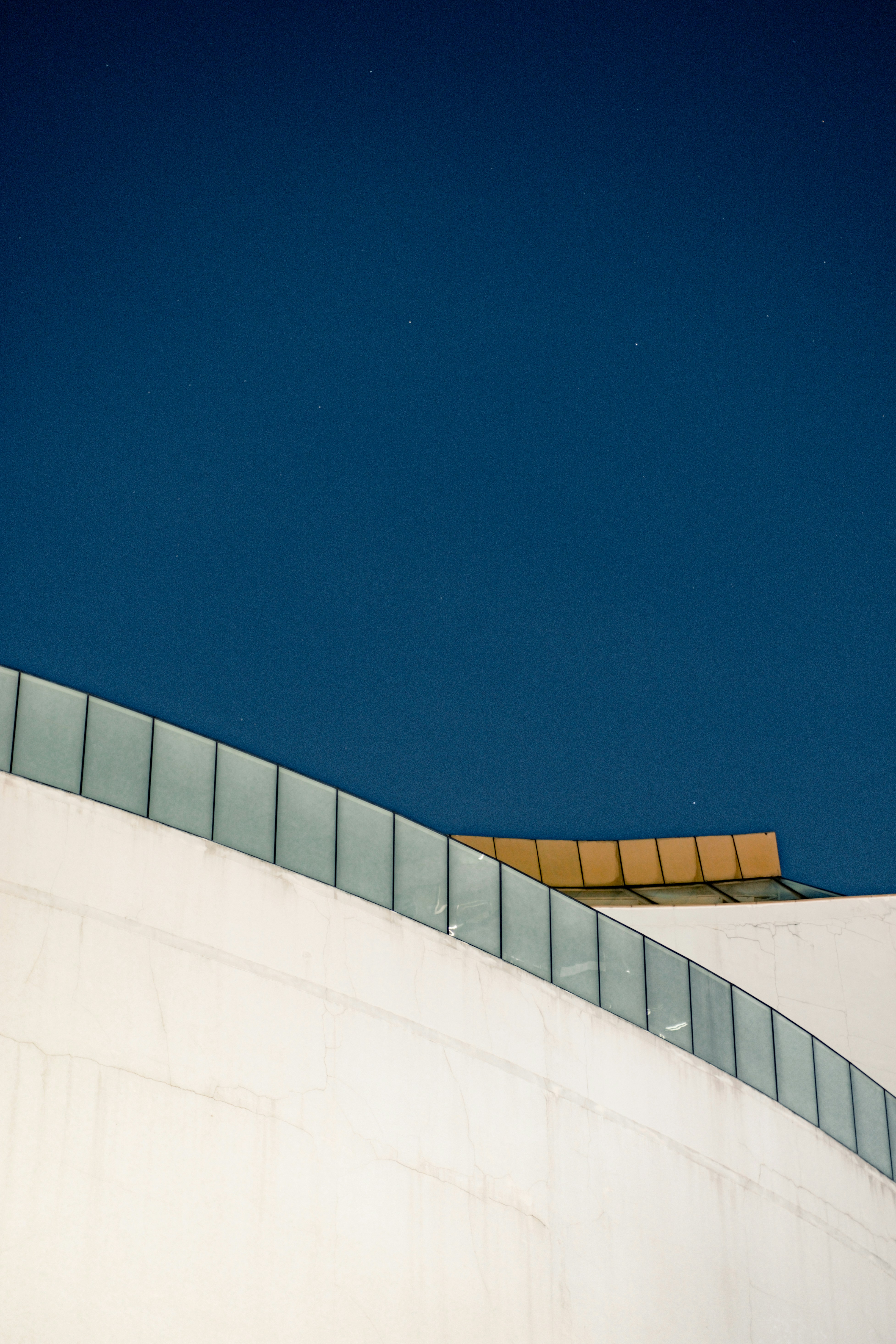 a man flying through the air while riding a snowboard