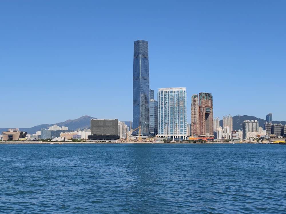 a large body of water with a city in the background