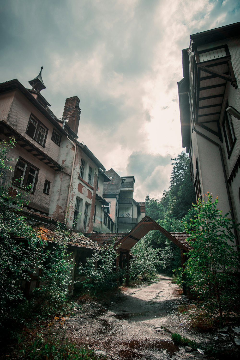 an old building with a bridge in front of it