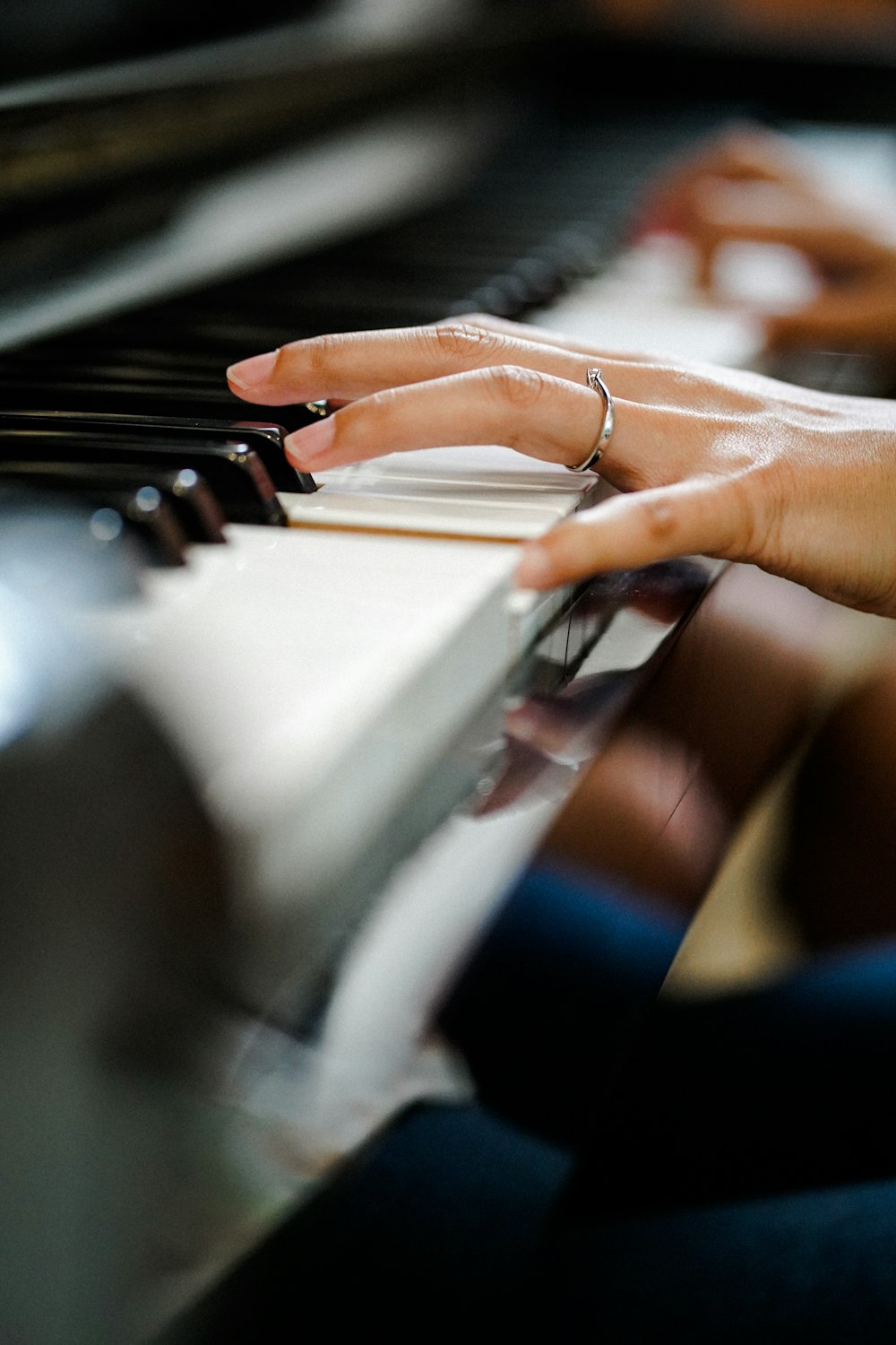 a close up of a person playing a piano