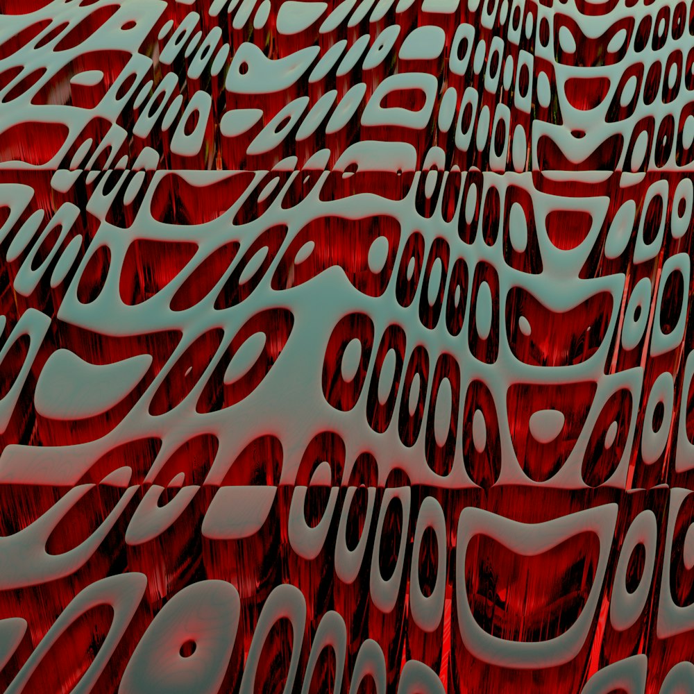 a large red sculpture with lots of wavy shapes