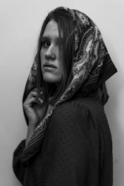 a woman with a scarf on her head