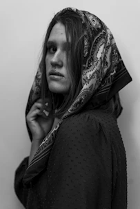 a woman with a scarf on her head