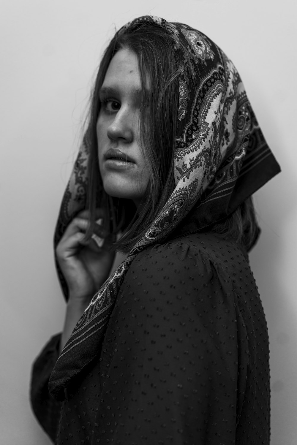 a woman with a scarf on her head