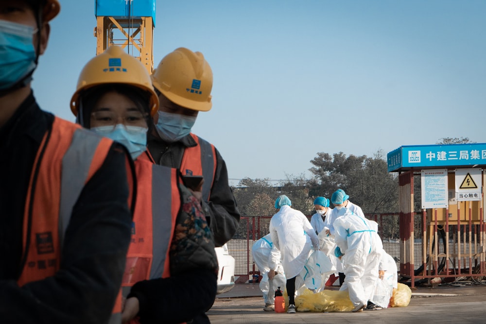a group of people wearing protective gear and masks