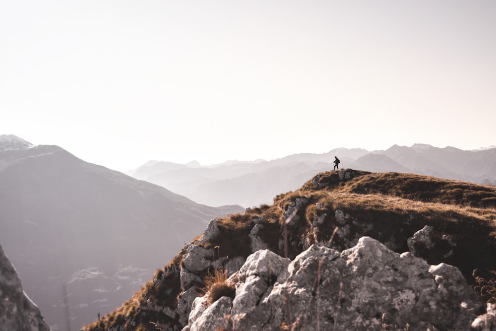 a person standing on top of a mountain